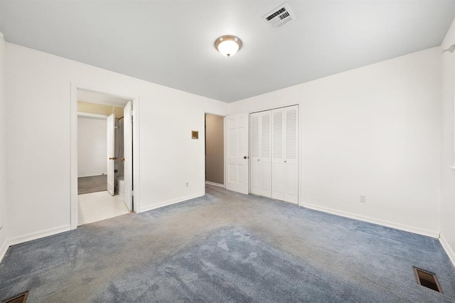 3222 Wilshire Ter, Oklahoma City, OK 73116 - unfurnished bedroom with carpet floors, a closet, and connected bathroom