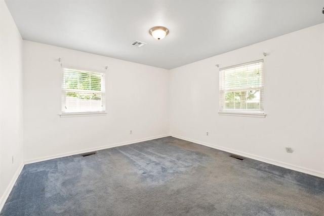 3222 Wilshire Ter, Oklahoma City, OK 73116 - empty room featuring dark colored carpet