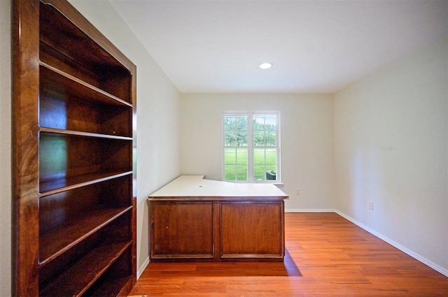 home office featuring wood finished floors, baseboards, and recessed lighting