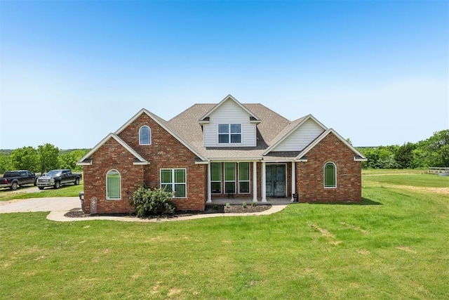 18421 State Highway 24, Purcell, OK 73080 - traditional-style home featuring brick siding and a front yard