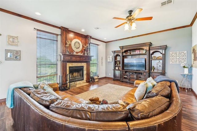 18421 State Highway 24, Purcell, OK 73080 - living room with baseboards, ceiling fan, wood finished floors, crown molding, and a large fireplace
