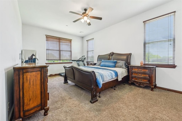 18421 State Highway 24, Purcell, OK 73080 - bedroom featuring carpet floors, baseboards, and a ceiling fan