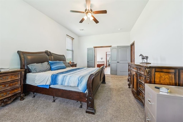 18421 State Highway 24, Purcell, OK 73080 - bedroom with light colored carpet, ensuite bath, and a ceiling fan