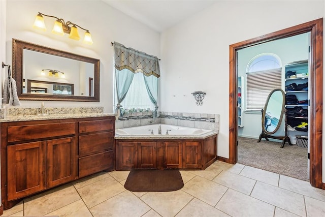 18421 State Highway 24, Purcell, OK 73080 - bathroom featuring plenty of natural light, vanity, a garden tub, and tile patterned floors