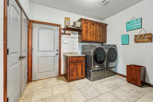 18421 State Highway 24, Purcell, OK 73080 - laundry area with separate washer and dryer, cabinet space, baseboards, and light tile patterned floors