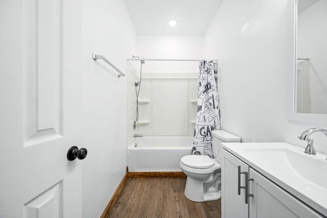 full bathroom featuring wood finished floors, toilet, vanity, and shower / bath combination with curtain