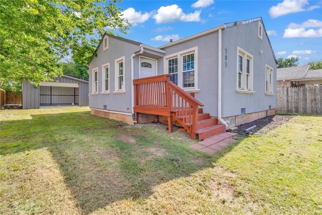503 W Martin St, El Reno, OK 73036 - back of house with crawl space, stucco siding, and an outdoor structure