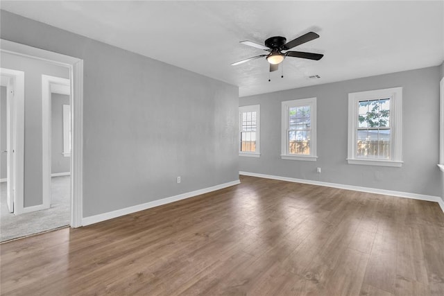 503 W Martin St, El Reno, OK 73036 - spare room with a ceiling fan, wood finished floors, and baseboards