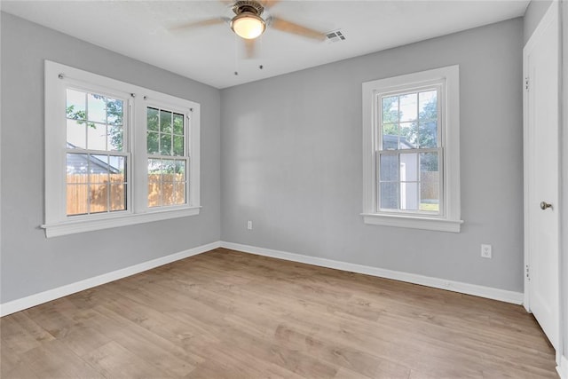 503 W Martin St, El Reno, OK 73036 - empty room featuring light wood-style floors, baseboards, and a ceiling fan