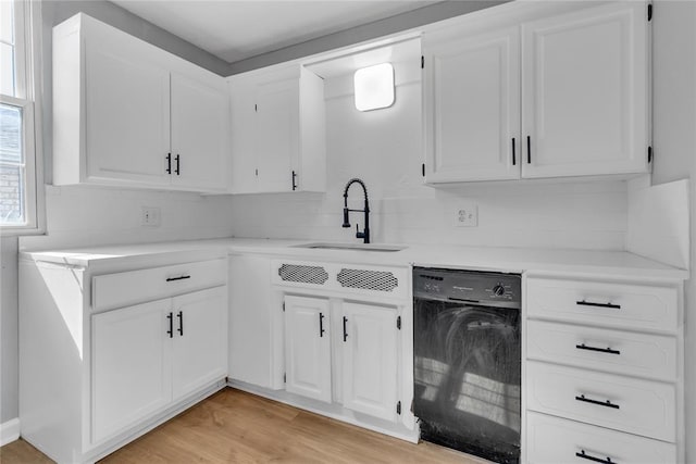 503 W Martin St, El Reno, OK 73036 - kitchen with a sink, dishwasher, tasteful backsplash, and light countertops
