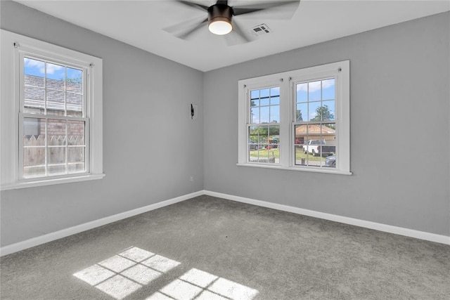503 W Martin St, El Reno, OK 73036 - spare room featuring plenty of natural light, carpet, ceiling fan, and baseboards