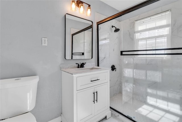 503 W Martin St, El Reno, OK 73036 - bathroom with a stall shower, toilet, vanity, and marble look tiles