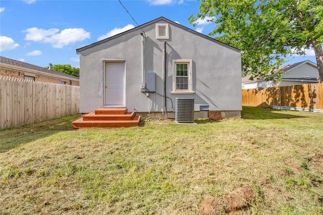 503 W Martin St, El Reno, OK 73036 - rear view of property with central air condition unit and stucco siding