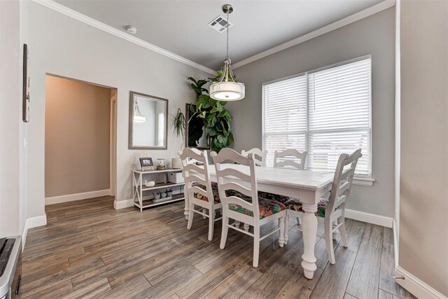 18337 Tombstone Trl, Norman, OK 73072 - dining space featuring ornamental molding, wood finished floors, and baseboards