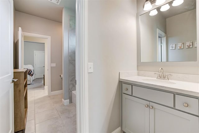 18337 Tombstone Trl, Norman, OK 73072 - ensuite bathroom featuring vanity, tile patterned floors, and baseboards