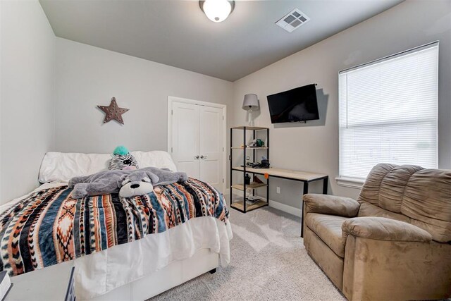 18337 Tombstone Trl, Norman, OK 73072 - bedroom featuring carpet floors, baseboards, and a closet