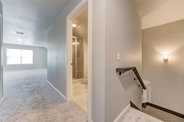 18337 Tombstone Trl, Norman, OK 73072 - hallway with carpet, baseboards, and an upstairs landing