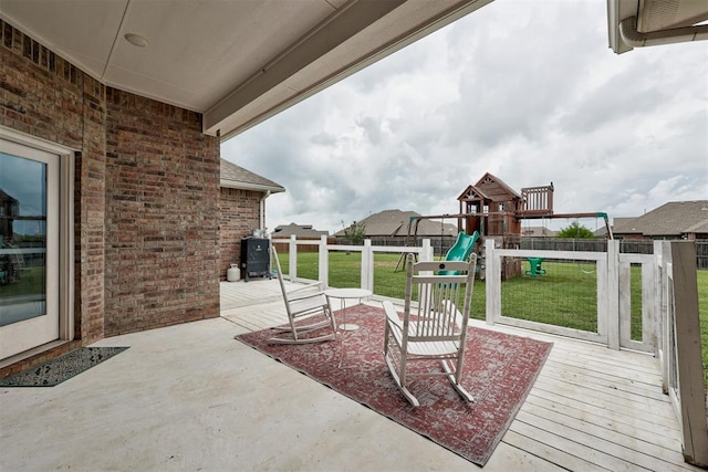 18337 Tombstone Trl, Norman, OK 73072 - view of patio / terrace with a playground and a wooden deck