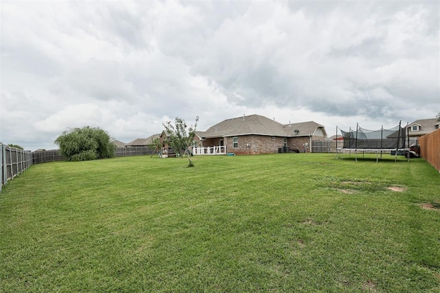 18337 Tombstone Trl, Norman, OK 73072 - view of yard featuring a trampoline
