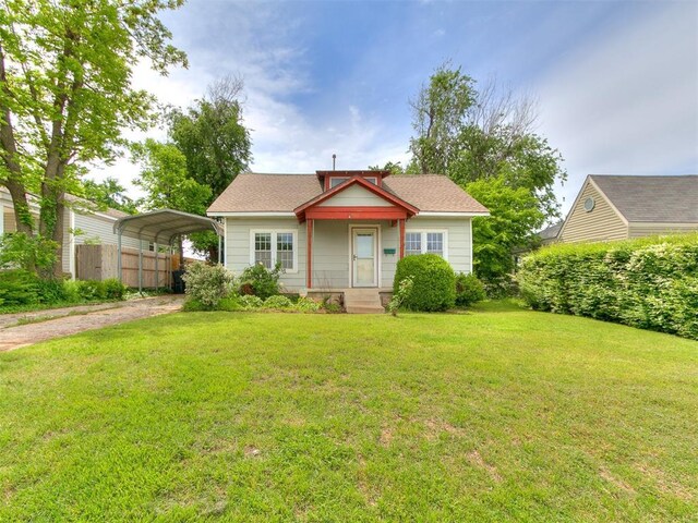 3617 N Westmont St, Oklahoma City, OK 73118 - bungalow-style home featuring a carport and driveway