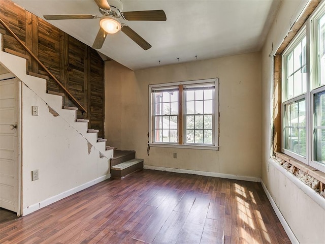 3617 N Westmont St, Oklahoma City, OK 73118 - unfurnished living room featuring wood finished floors, stairway, baseboards, and ceiling fan