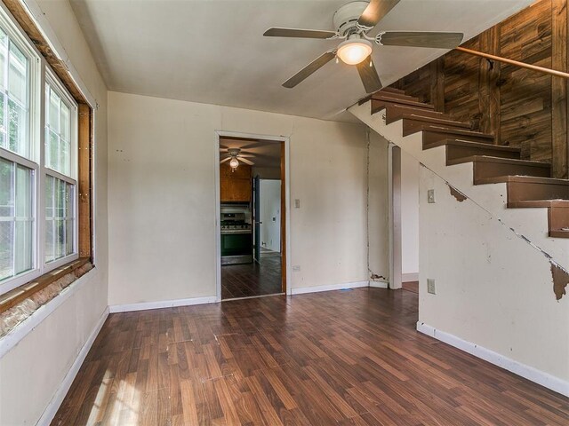 3617 N Westmont St, Oklahoma City, OK 73118 - unfurnished living room featuring ceiling fan, wood finished floors, and baseboards