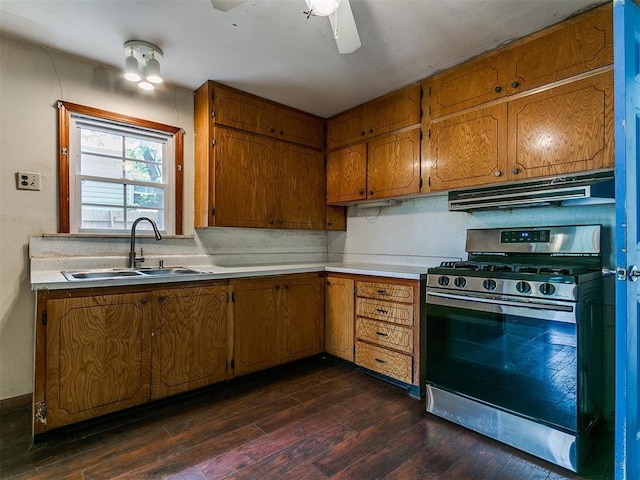 3617 N Westmont St, Oklahoma City, OK 73118 - kitchen with stainless steel range with gas stovetop, ventilation hood, a sink, dark wood finished floors, and brown cabinetry