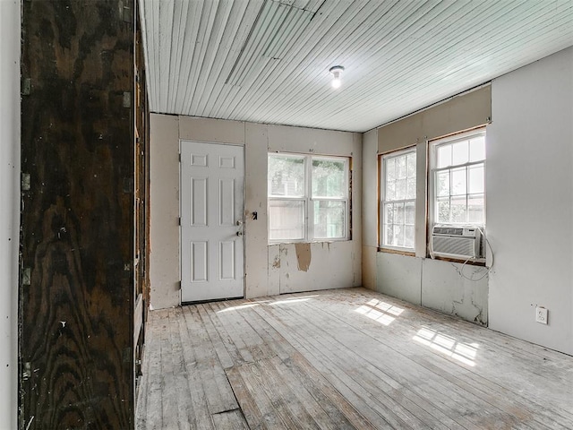 3617 N Westmont St, Oklahoma City, OK 73118 - unfurnished room featuring cooling unit and hardwood / wood-style floors