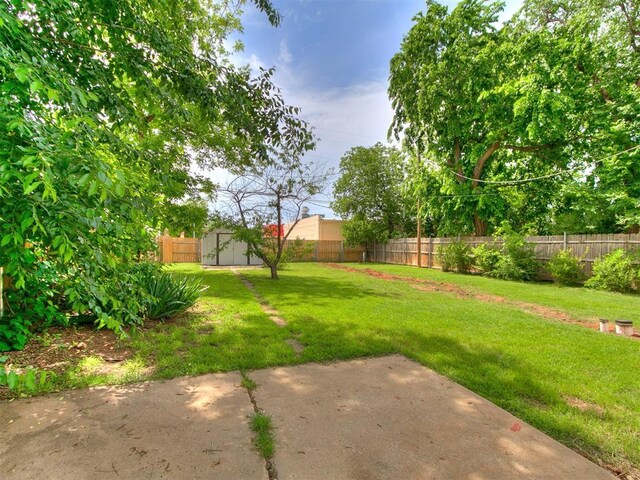 3617 N Westmont St, Oklahoma City, OK 73118 - view of yard featuring a shed, an outdoor structure, and a patio area