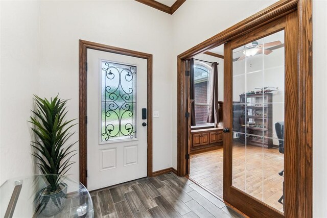 11423 Village Ave, Midwest City, OK 73130 - entrance foyer featuring dark wood-type flooring, baseboards, and ornamental molding