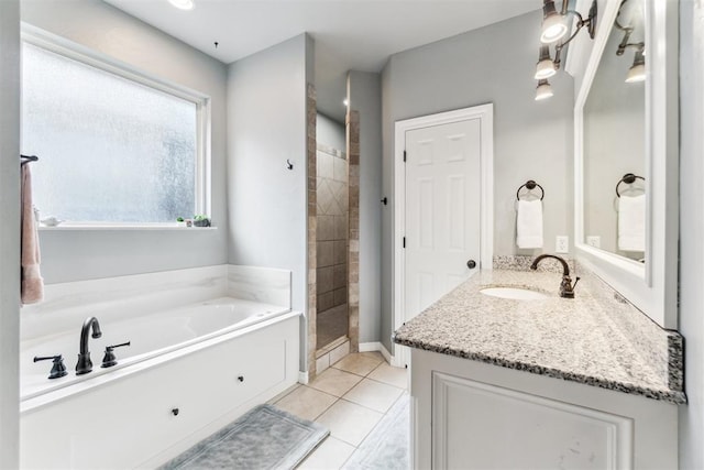 11423 Village Ave, Midwest City, OK 73130 - bathroom with a garden tub, tiled shower, tile patterned floors, and vanity