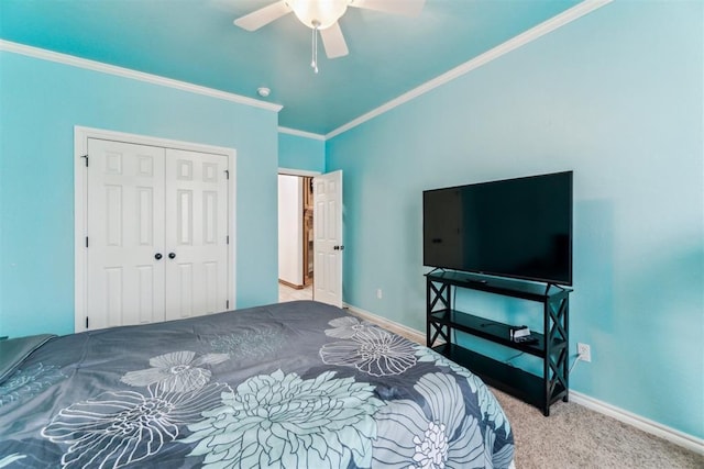 11423 Village Ave, Midwest City, OK 73130 - carpeted bedroom featuring ornamental molding, a closet, baseboards, and a ceiling fan