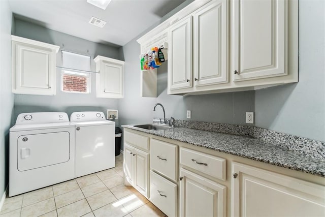 11423 Village Ave, Midwest City, OK 73130 - washroom featuring cabinet space, separate washer and dryer, and light tile patterned floors
