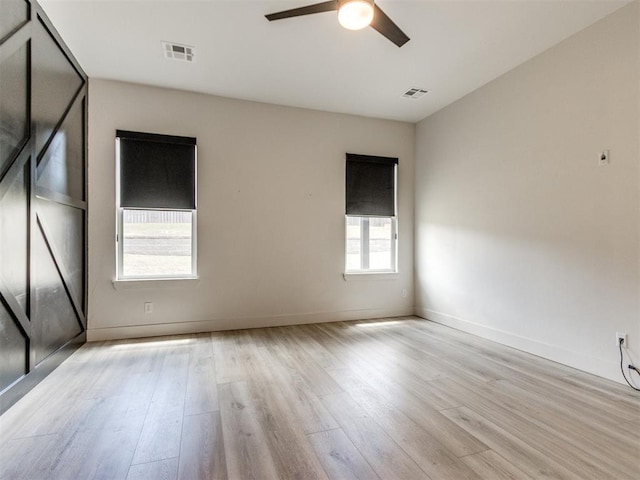 8916 NW 130th St, Oklahoma City, OK 73142 - spare room with wood finished floors, ceiling fan, and baseboards