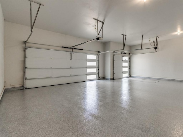 8916 NW 130th St, Oklahoma City, OK 73142 - garage with a garage door opener and baseboards
