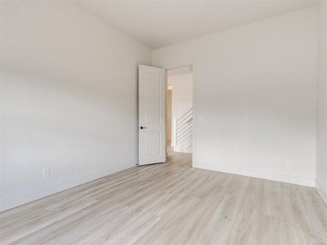 8916 NW 130th St, Oklahoma City, OK 73142 - spare room featuring wood finished floors and baseboards