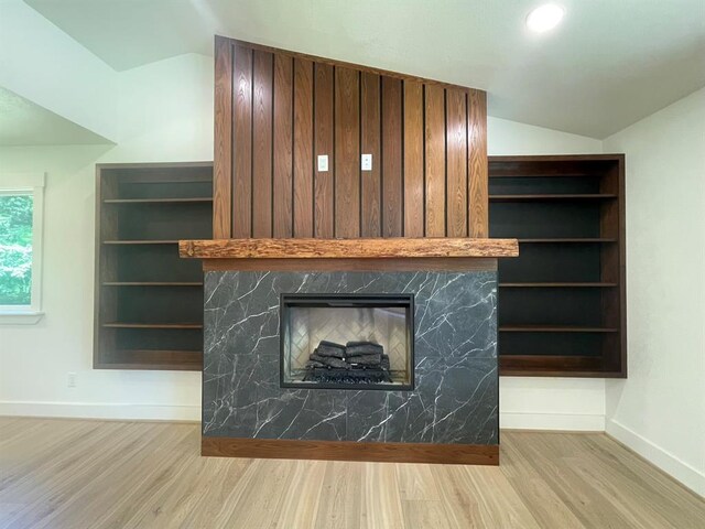 1920 Glover Golden Rd, Broken Bow, OK 74728 - detailed view of wood finished floors, a fireplace, and baseboards