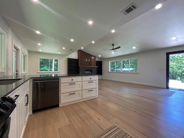 1920 Glover Golden Rd, Broken Bow, OK 74728 - kitchen featuring dishwasher, open floor plan, light wood-style floors, dark countertops, and range with gas stovetop