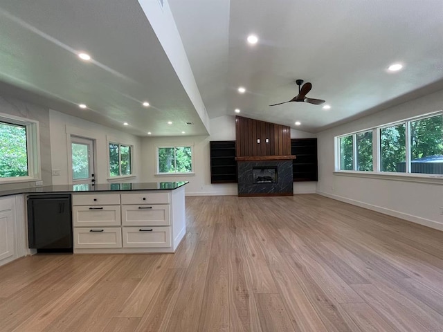 1920 Glover Golden Rd, Broken Bow, OK 74728 - kitchen with dishwasher, white cabinetry, a fireplace, light wood-style floors, and a ceiling fan