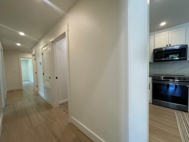 1920 Glover Golden Rd, Broken Bow, OK 74728 - hall featuring light wood finished floors, baseboards, and recessed lighting