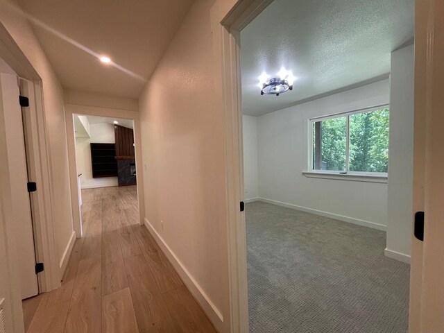 1920 Glover Golden Rd, Broken Bow, OK 74728 - hallway with baseboards and wood finished floors