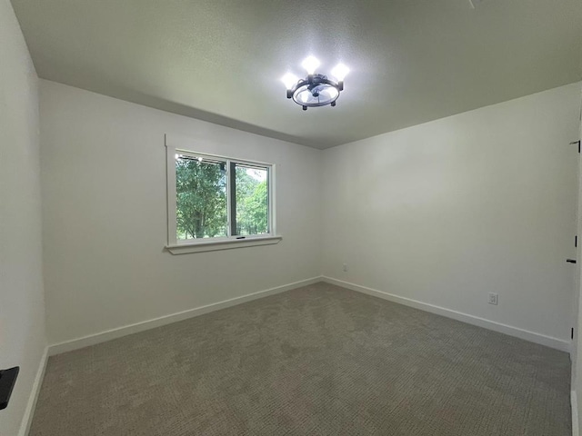 1920 Glover Golden Rd, Broken Bow, OK 74728 - unfurnished room featuring baseboards and carpet flooring
