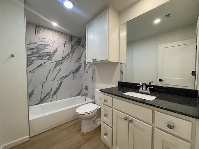 1920 Glover Golden Rd, Broken Bow, OK 74728 - full bathroom with wood finished floors, toilet, vanity, recessed lighting, and tub / shower combination