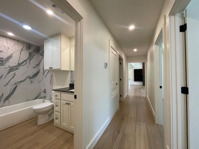 1920 Glover Golden Rd, Broken Bow, OK 74728 - corridor with light wood finished floors, recessed lighting, and baseboards
