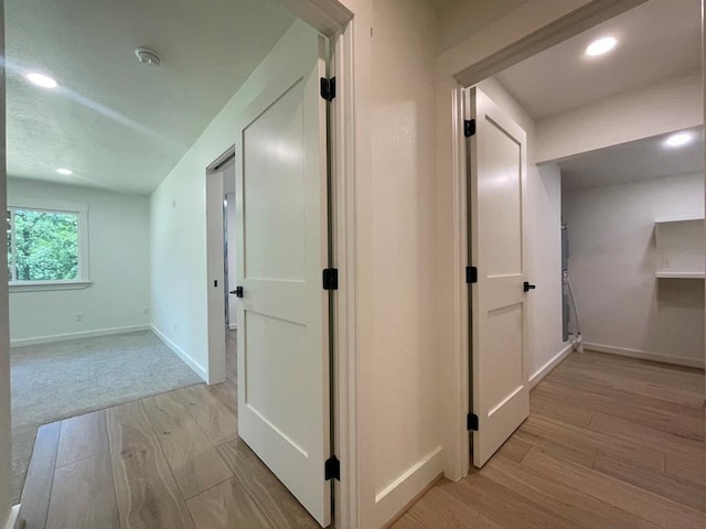 1920 Glover Golden Rd, Broken Bow, OK 74728 - hall with light wood finished floors, baseboards, and recessed lighting