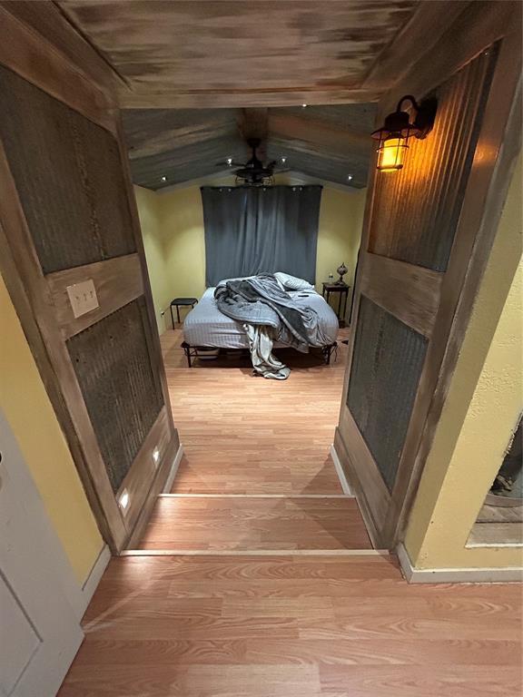 bedroom featuring light wood-type flooring and baseboards