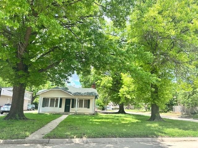 2801 NW 15th St, Oklahoma City, OK 73107 - view of front of house with a front yard and a chimney