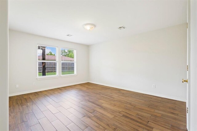 9801 Ashley Pl, Oklahoma City, OK 73120 - empty room with wood finished floors and baseboards