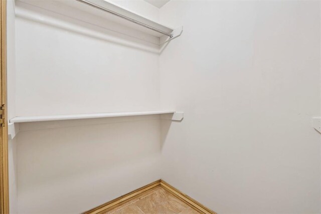 9801 Ashley Pl, Oklahoma City, OK 73120 - walk in closet featuring tile patterned floors