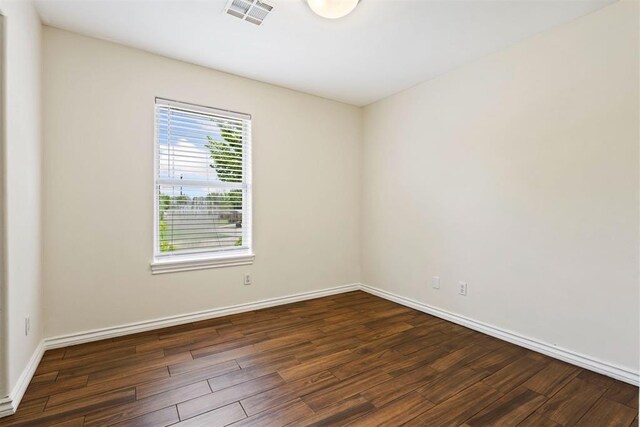 9801 Ashley Pl, Oklahoma City, OK 73120 - unfurnished room with wood finished floors and baseboards